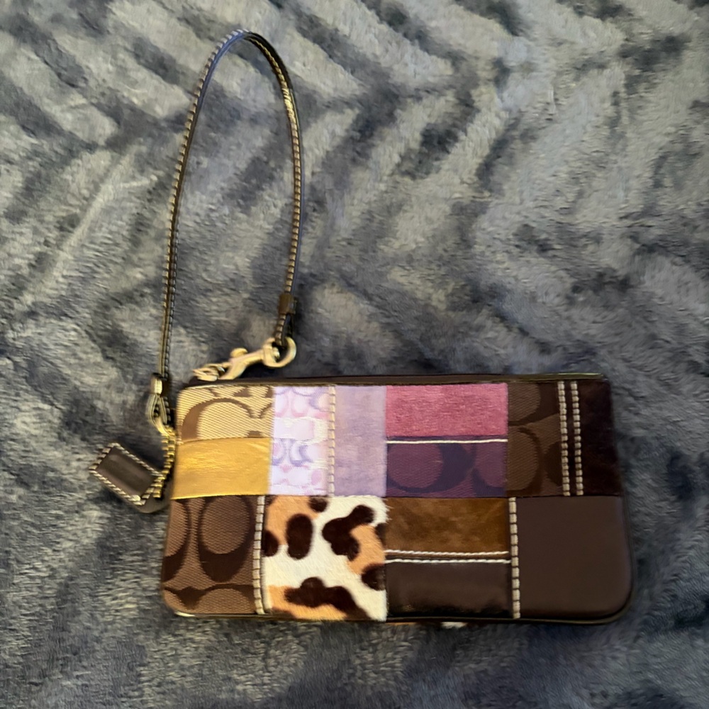 Gentle used Coach Wristlet with Animal Print and Purple Accents pouch